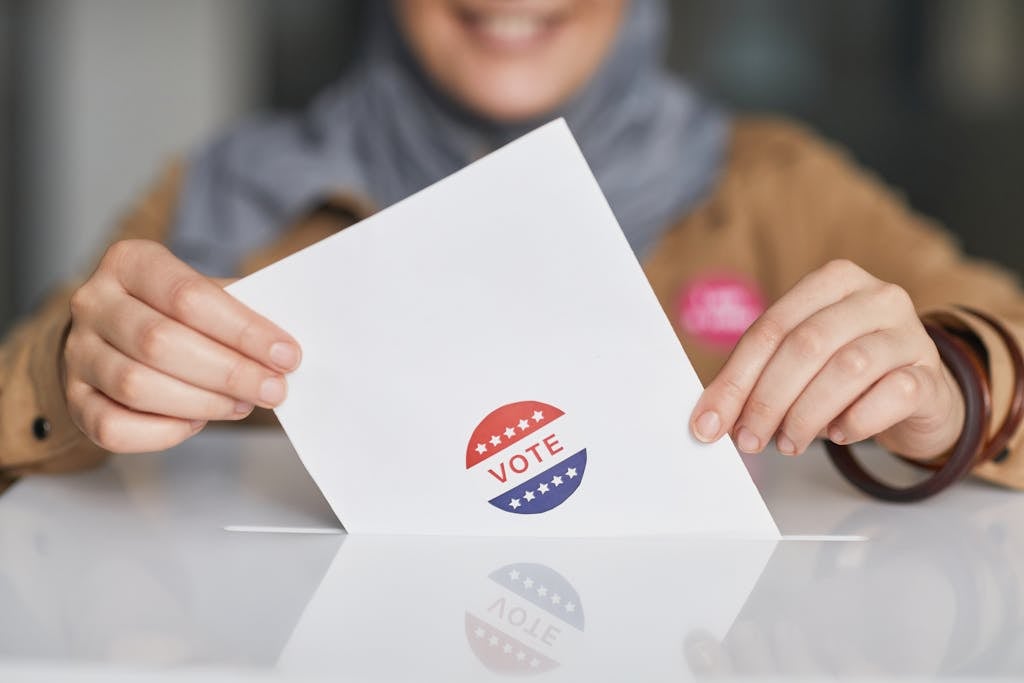 A Woman Dropping her Vote in a Box